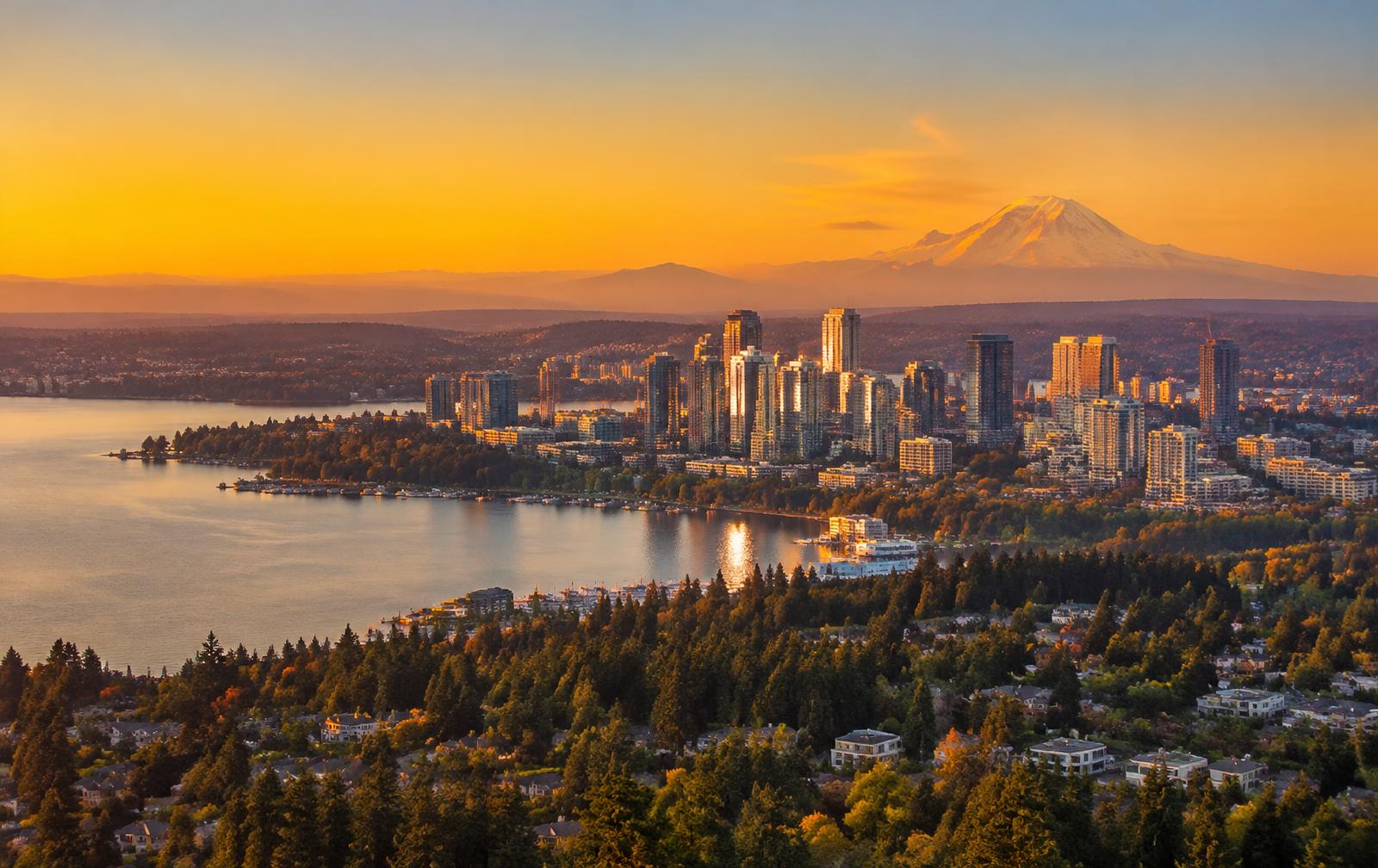 Bellevue skyline and Lake Washington neighborhoods at golden hour with Mount Rainier behind