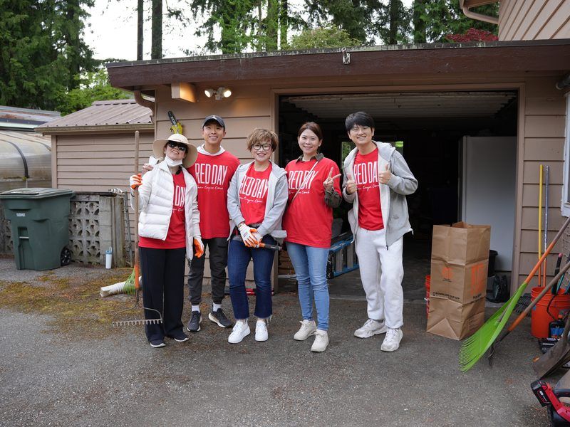 Maggie Sun Real Estate agents volunteering on Keller Williams RED Day in the community
