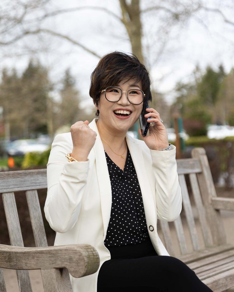 Maggie Sun, managing broker, on a client call outside her Bellevue office
