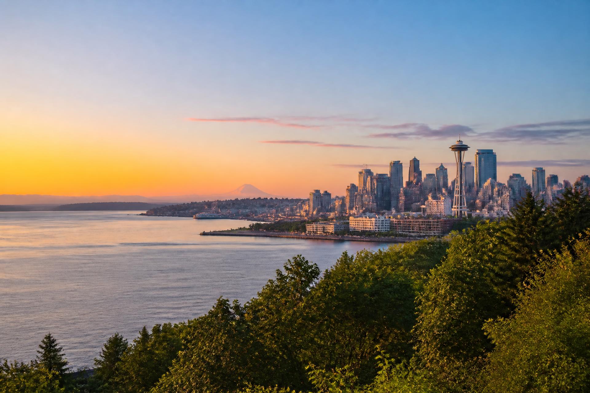 Seattle skyline at golden hour with Puget Sound and Mount Rainier