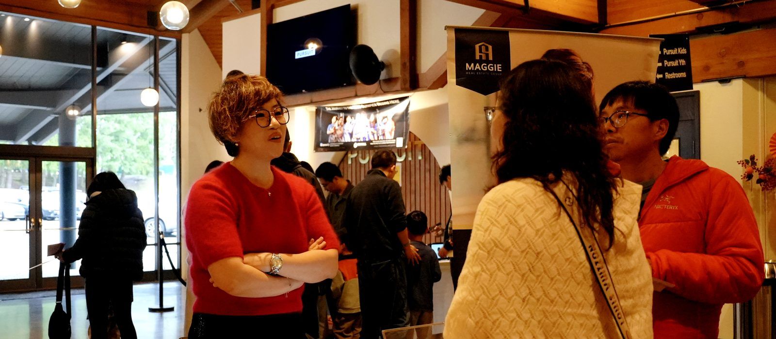 Maggie Sun Real Estate team meeting clients at a Bellevue open-house event